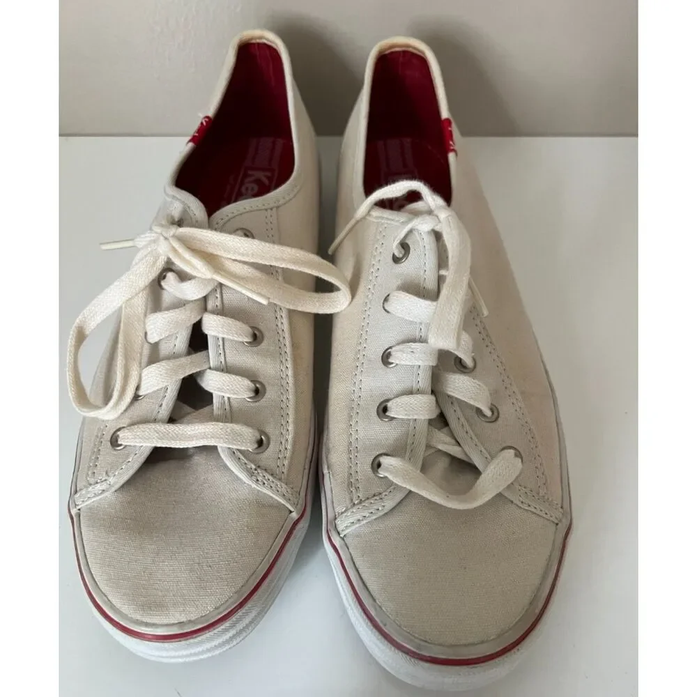 Keds low top canvas lace up sneakers with red trim. Size 8.